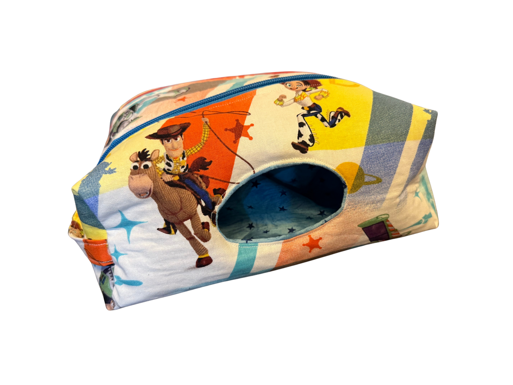 Colorful diaper bag with cartoon characters on a white background