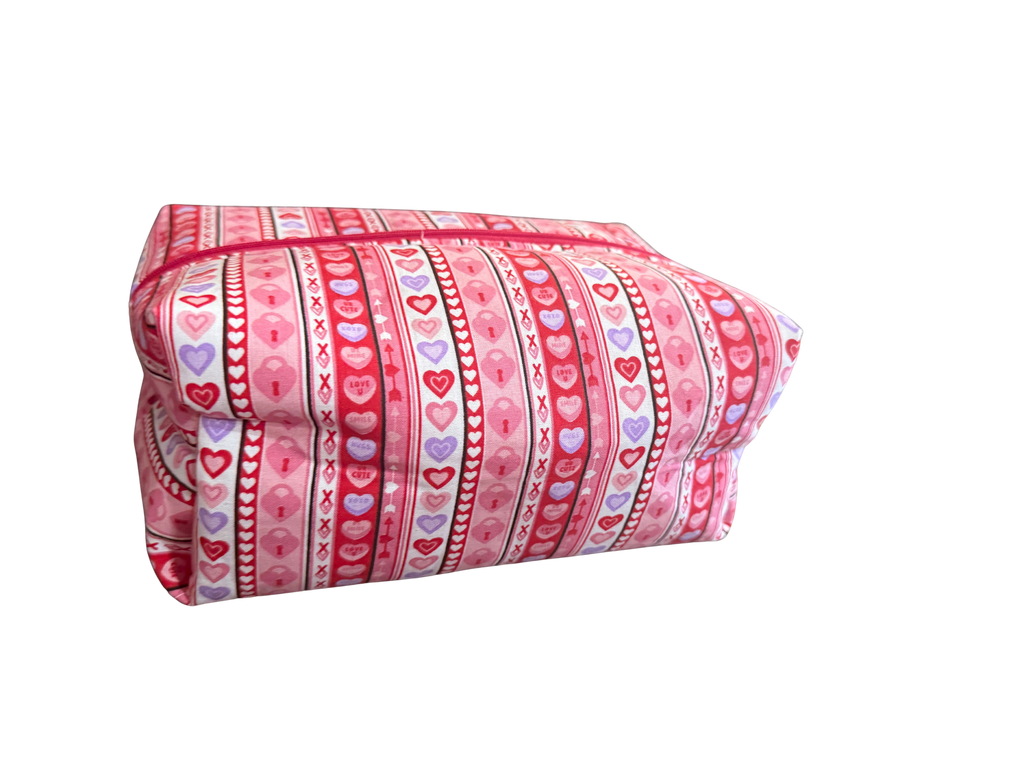 bag with pink fabric with heart and stripe pattern on a white background