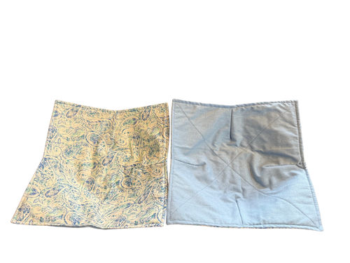 Two fabric swatches, one with a yellow and blue pattern and the other plain light blue, on a white background.
