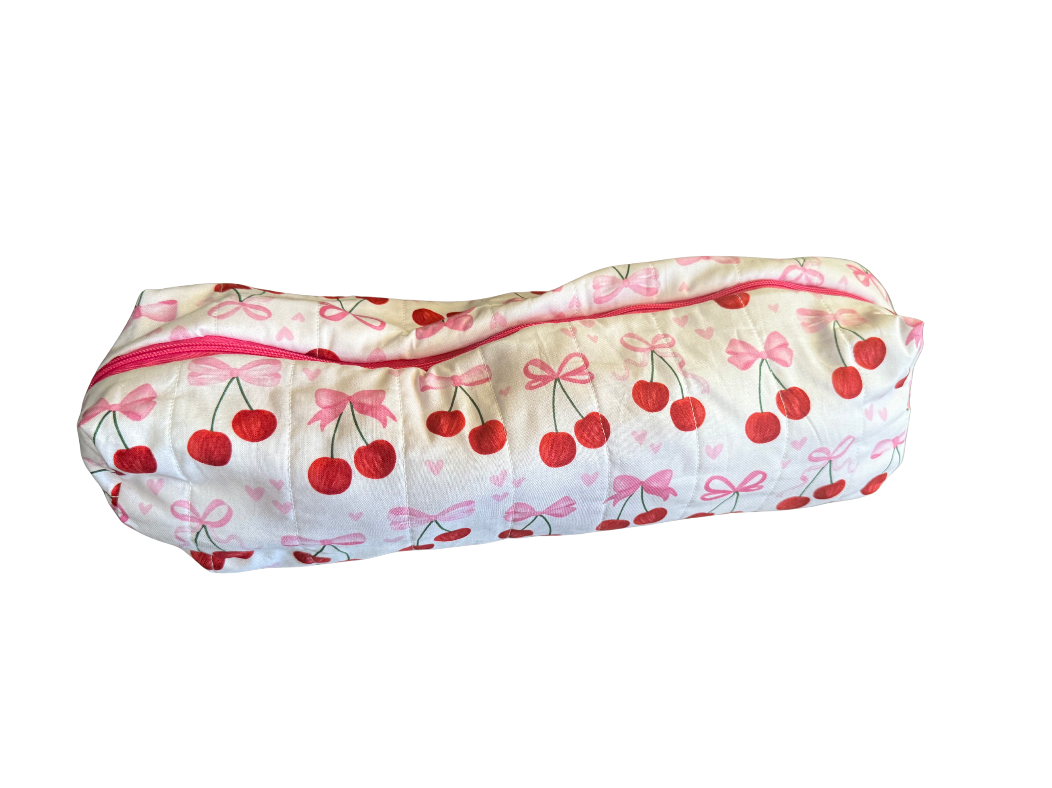 long zippered bag with cherry and bow pattern on a white background