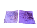 Two purple fabric samples on a white background