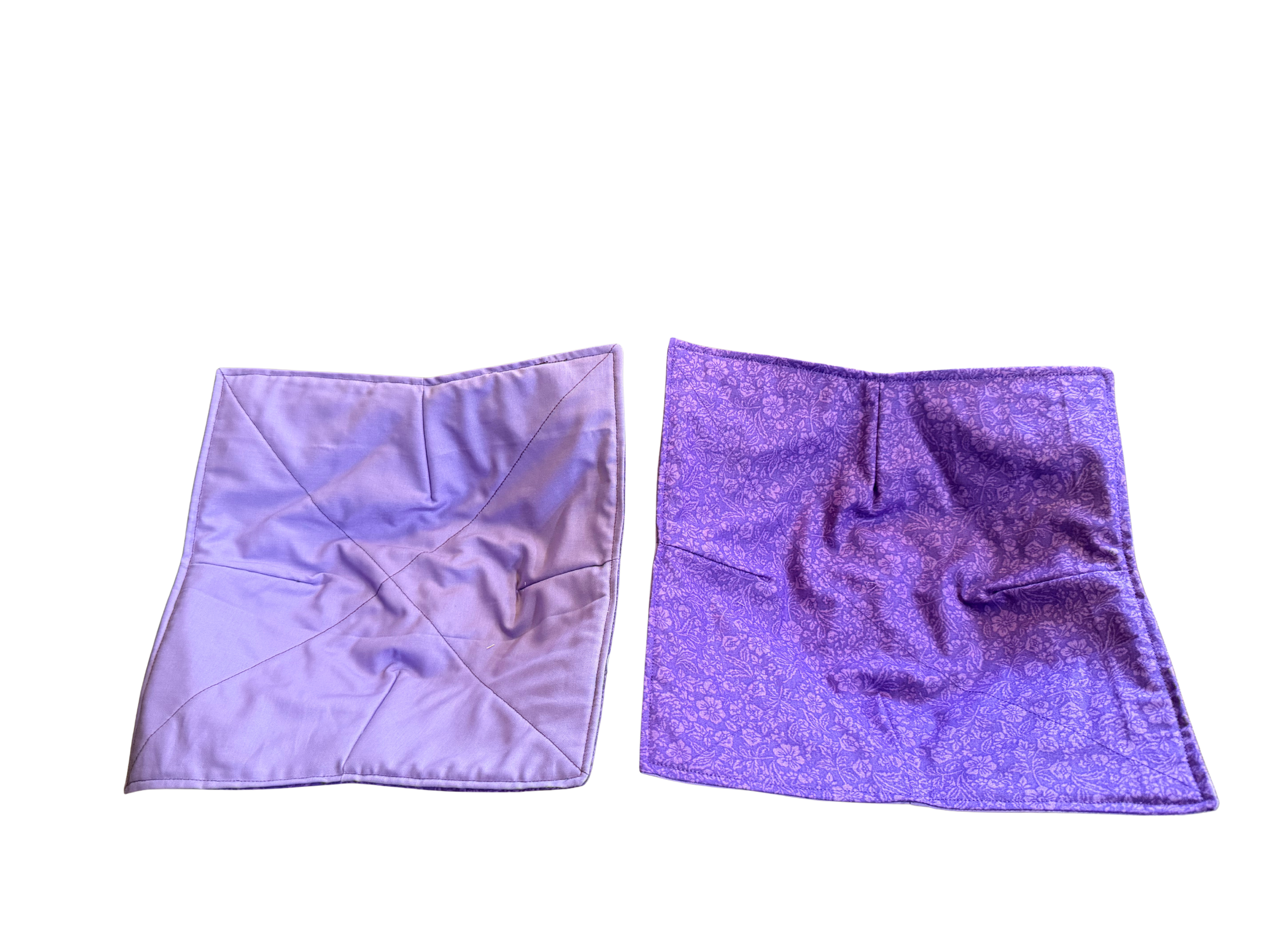 Two purple fabric samples on a white background
