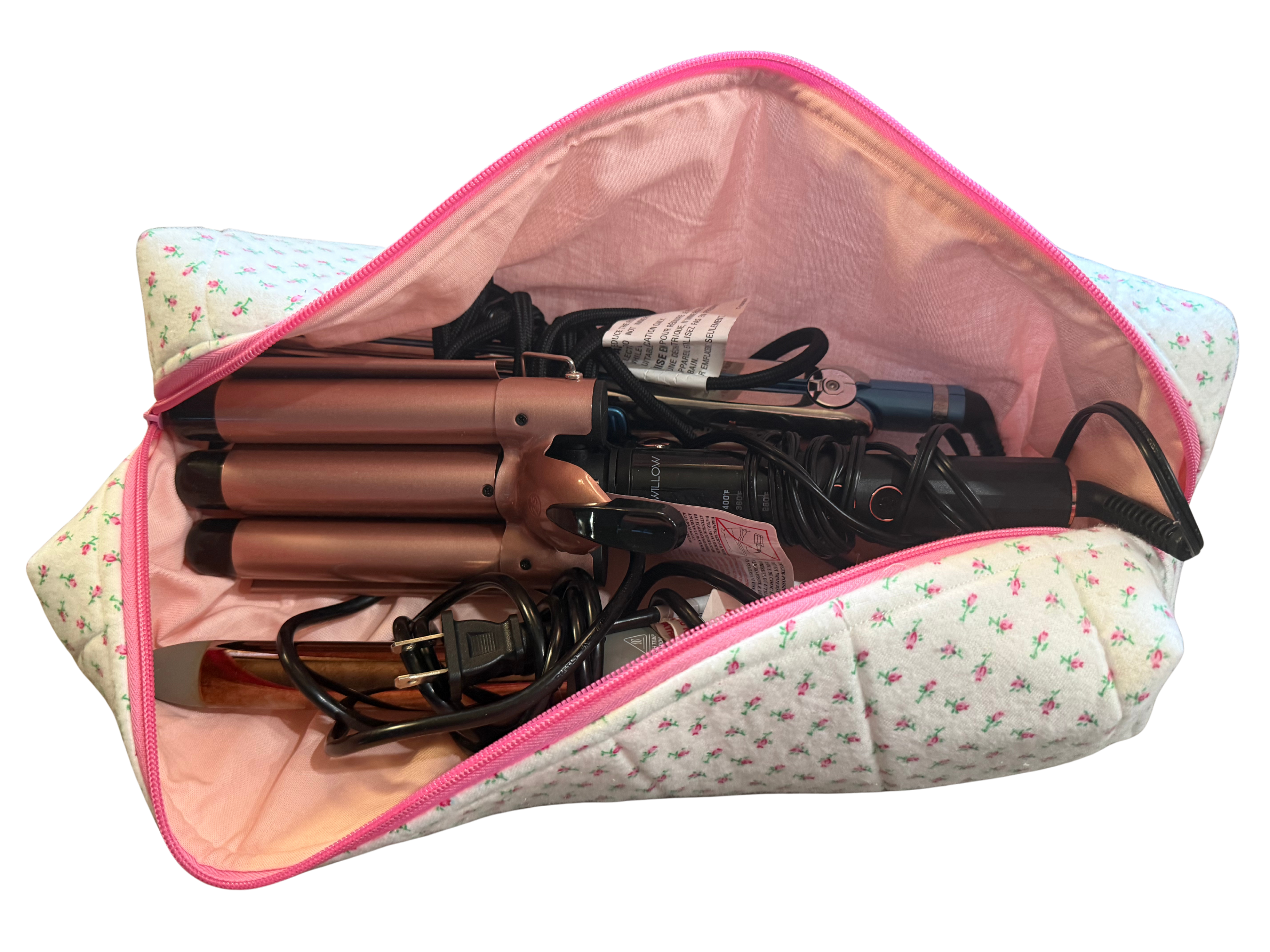 Set of hair straighteners and curlers in a floral-patterned pouch on a white background