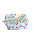 Blue checkered bag with red cherries on a white background