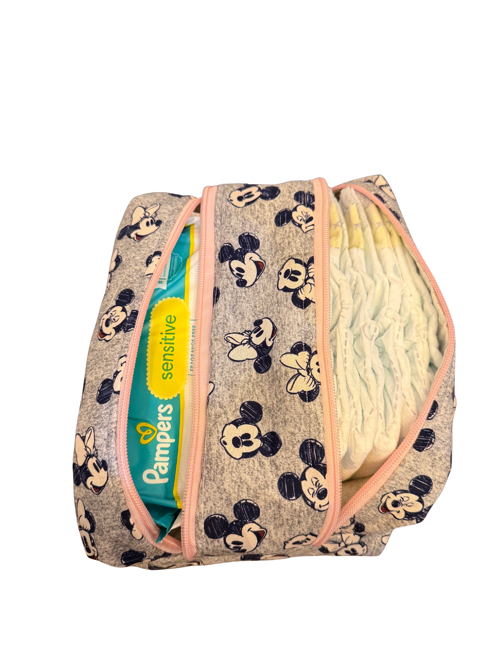 Diaper bag with Minnie Mouse pattern and Pampers sensitive wipes visible