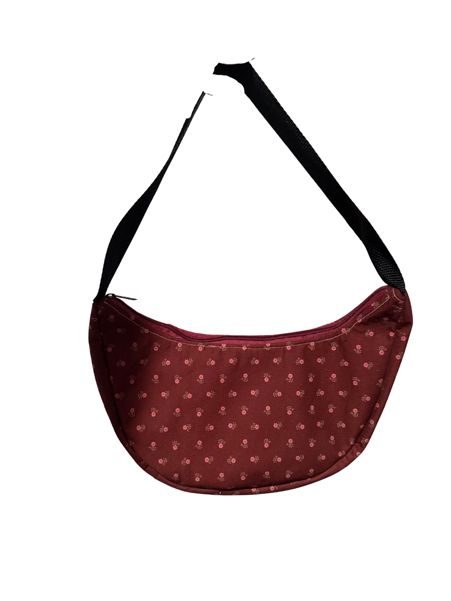 Maroon handbag with black strap on a white background