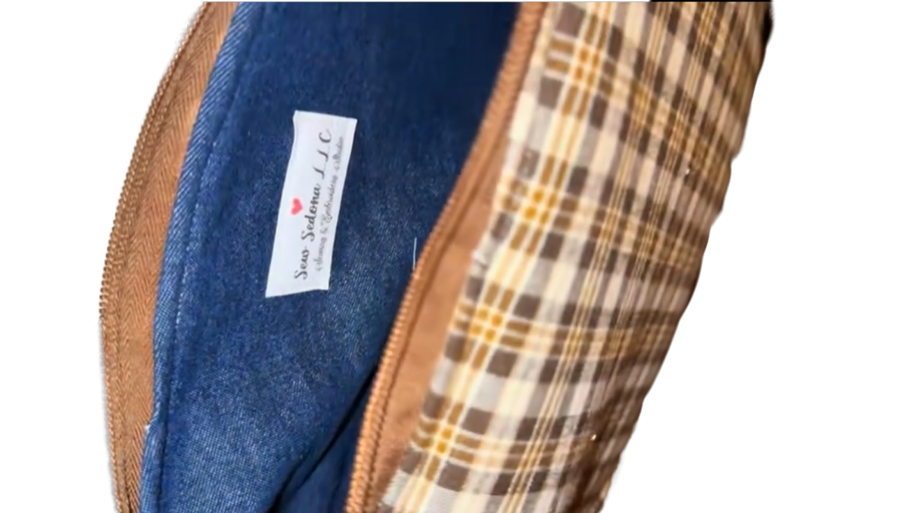 Close-up of a fabric with plaid pattern and denim blue label on a white background