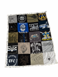 Quilt made from various t-shirt patches with different designs and text.