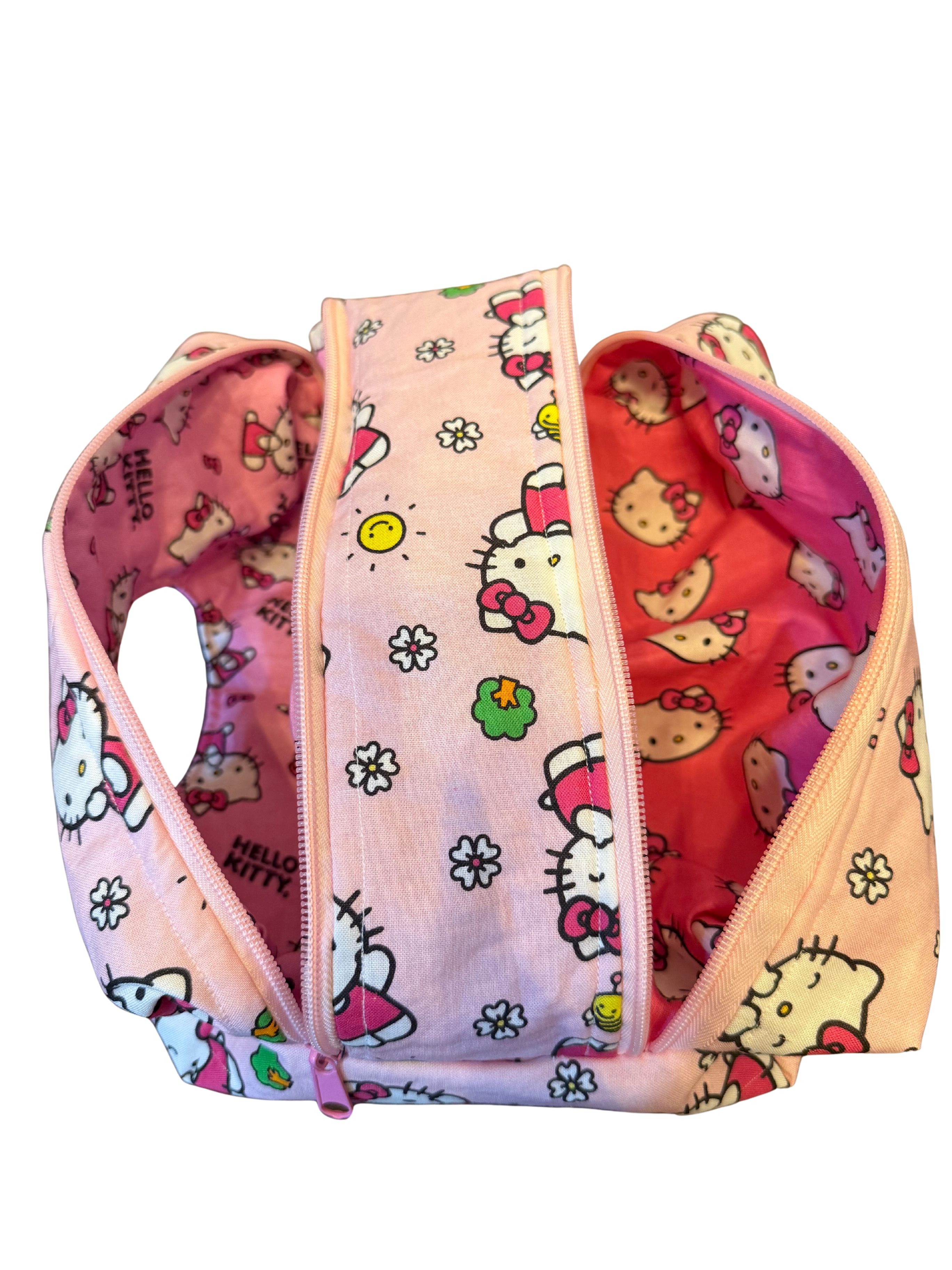 Hello Kitty patterned bag  with multiple color sections on a white background
