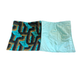 Two fabric swatches, one with a geometric pattern and the other solid light blue, on a white background.